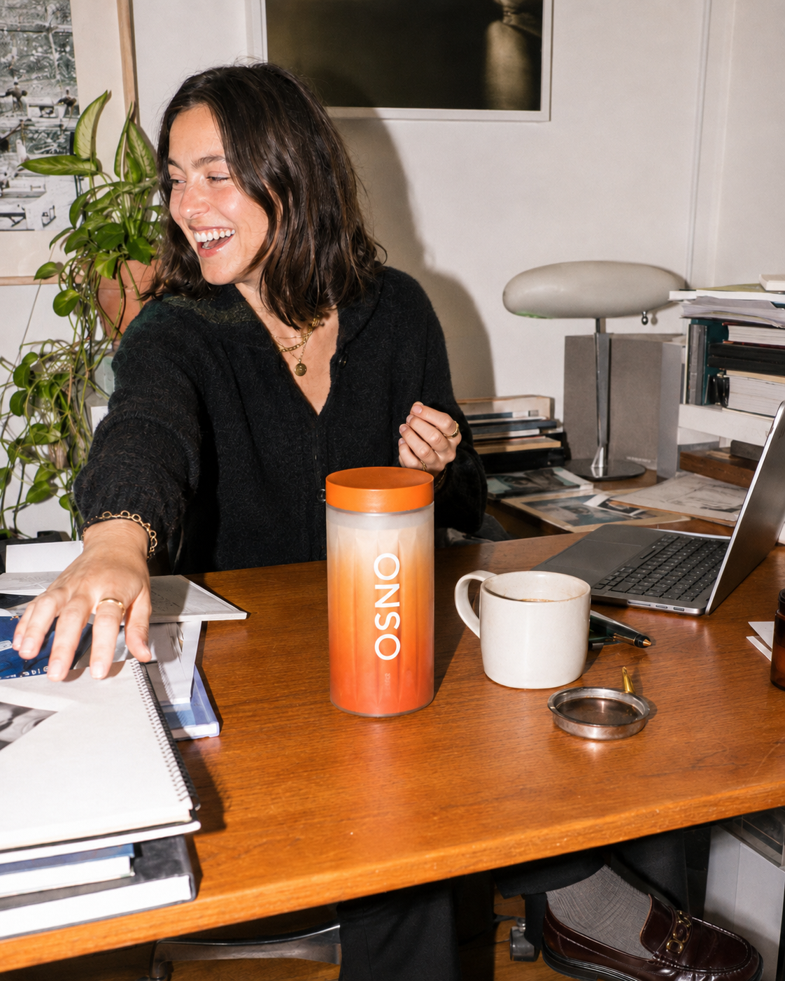 ONSO container on a desk beside a laptop and mug