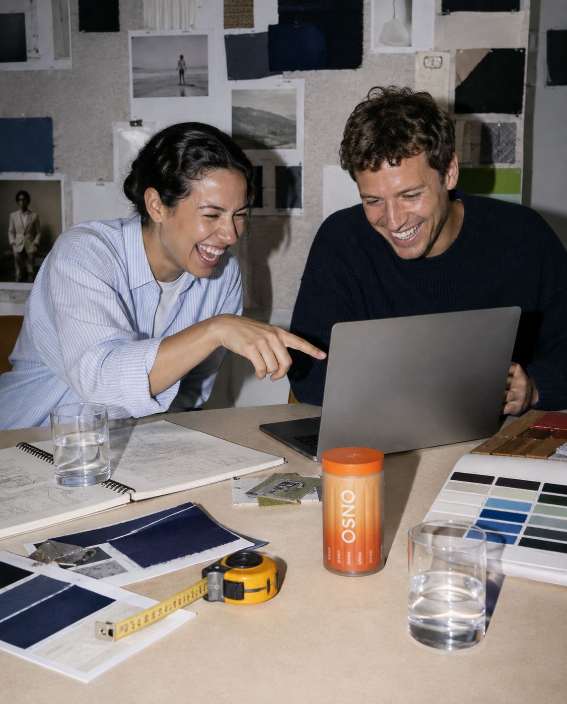 Two people working at a studio table with an ONSO container